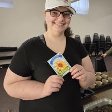 Mindi sharing what she's planting at the St. Johnsbury Community Skills Group